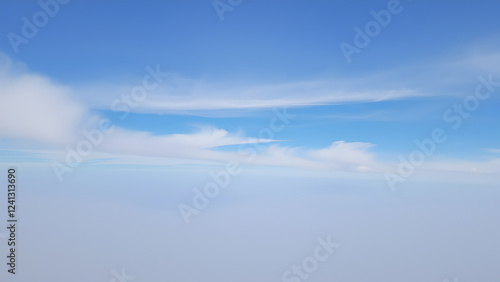 Aerial View of Blue Sky and White Clouds Above the Cloud Layer