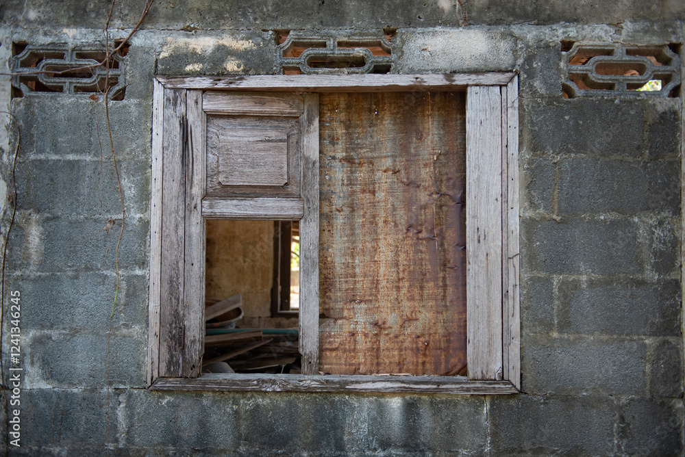 Abandoned window frame with rustic wood and stone wall Abandoned window frame with rustic wood and stone wall