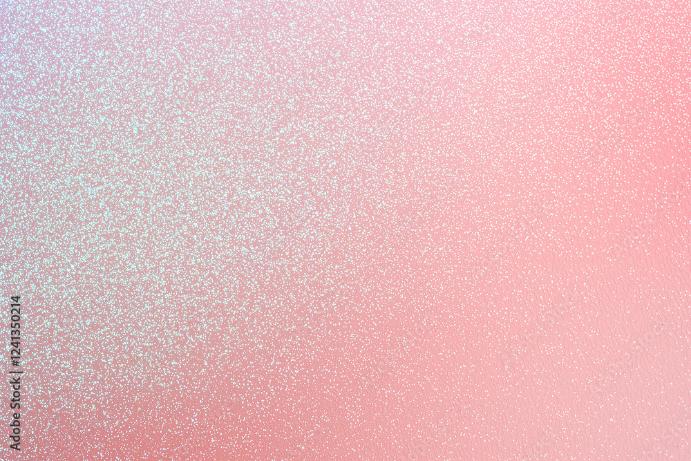 Fototapeta premium Soft pastel pink texture with radiant shimmer, creating dreamy atmosphere. Ideal for backgrounds, wallpapers, or design projects