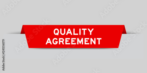 Red color inserted label with word quality agreement on gray background