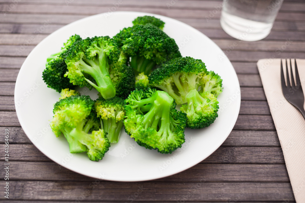 Diet food. steamed broccoli on plate Diet food. steamed broccoli on plate