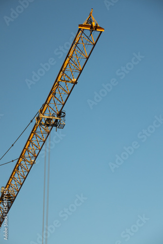  Construction Yellow crane against blue sky