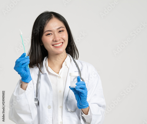 Asian gynecologist with cervical cancer specimen collection kit photo