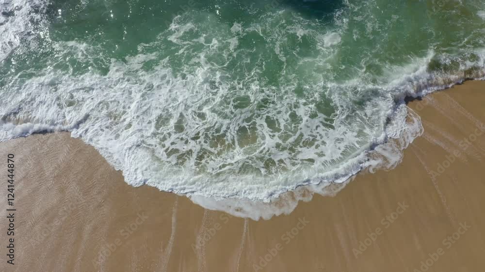 Close up of ocean waves rolling onto a beautiful beach at sunrise Close up of ocean waves rolling onto a beautiful beach at sunrise