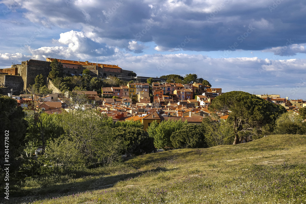Cloudy sky over houses in spring, Collioure, France Cloudy sky over houses in spring, Collioure, France