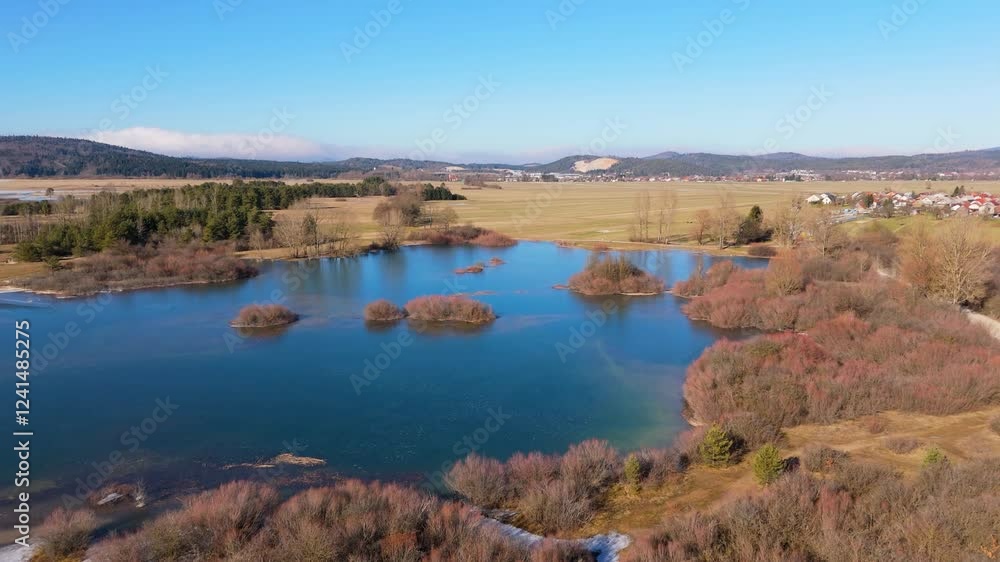 Cerknica Lake from above in the winter with ice already melting, drone video Cerknica Lake from above in the winter with ice already melting, drone video