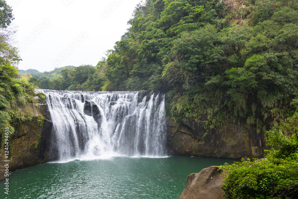 Scenic Taiwan Shifen waterfall with cascading waters Scenic Taiwan Shifen waterfall with cascading waters