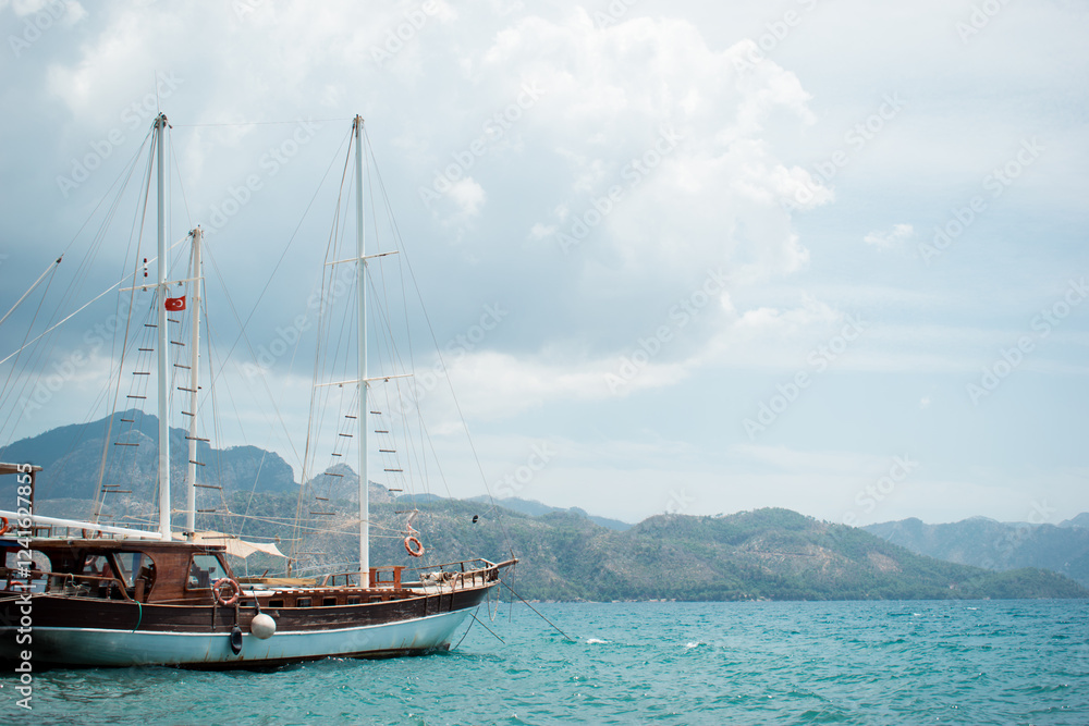 A cove with a yacht. A boat trip. Luxury yacht rentals. The marina. Luxury yachts in summer. Sea yacht in the port. Magnificent view of the mountains. A cove with a yacht. A boat trip. Luxury yacht rentals. The marina. Luxury yachts in summer. Sea yacht in the port. Magnificent view of the mountains.