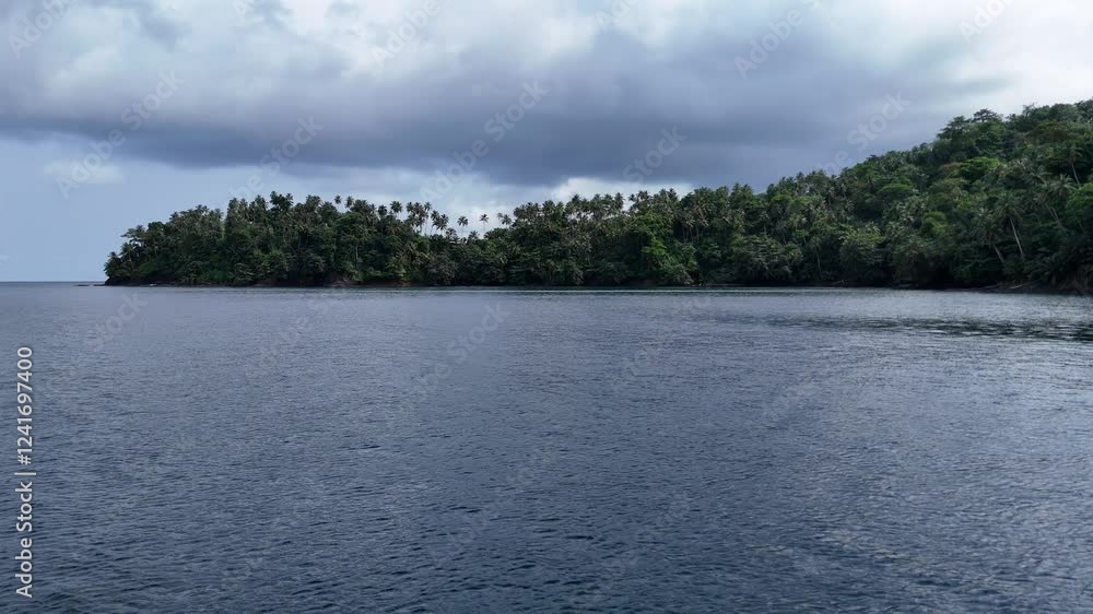 Sao Tome and Principe - Aerial View of Palm-Covered Peninsula. Lush Tropical Landscape Surrounded by Pristine Ocean Waters. Sao Tome and Principe - Aerial View of Palm-Covered Peninsula. Lush Tropical Landscape Surrounded by Pristine Ocean Waters.