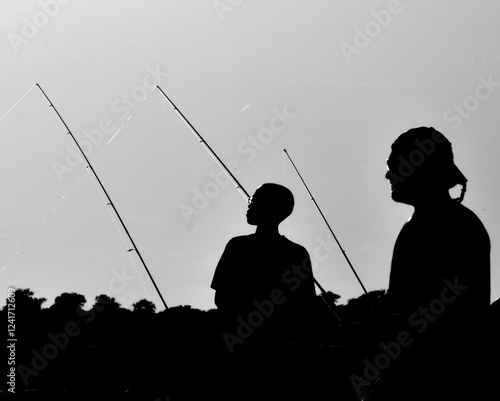 silhouette of a fisherman