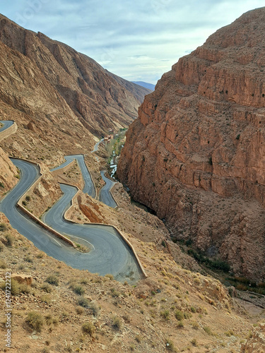 Winding Mountain Road Through Arid Landscapes Showcases the Beauty of Nature's Rugged Terrain in Crisp Daylight