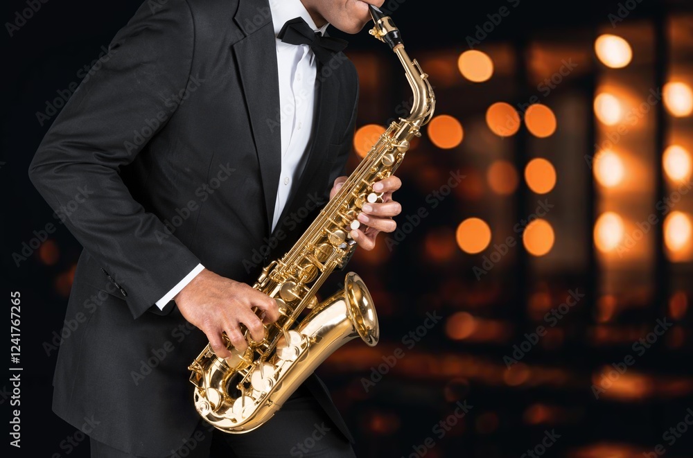 Naklejka premium Young jazz musician man playing saxophone