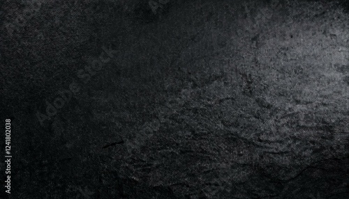 Abstract black background. Wide banner. Dark rock surface texture. Close-up. Stone rough background with copy space for design. Panoramic.