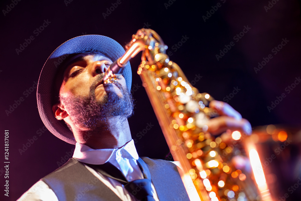 Low angle portrait of saxophonist with hat