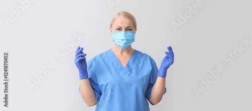 Mature female nurse on ligh...