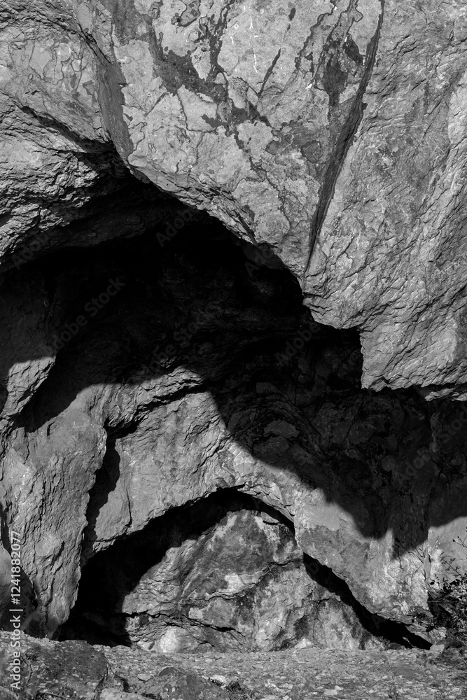 Gateway to the Unknown: Cave Entrance and Rock Formations Gateway to the Unknown: Cave Entrance and Rock Formations