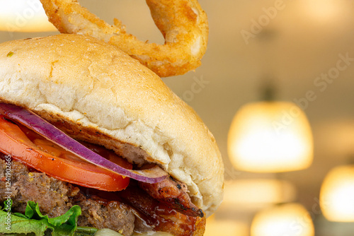 Gourmet Burger with Onion Ring and Bacon photo