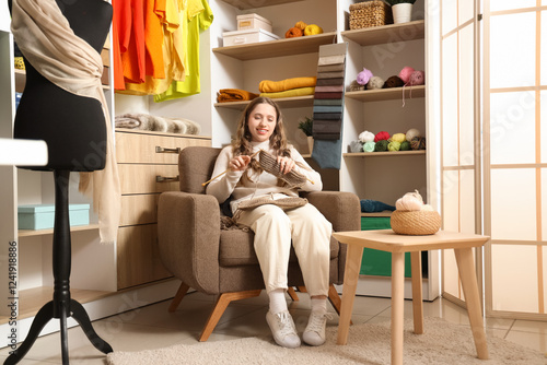 Female tailor knitting with...