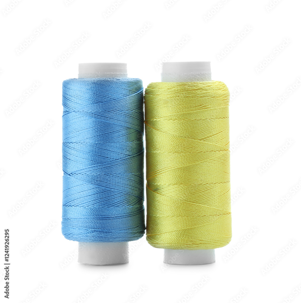 Spools of bright sewing threads isolated on white Spools of bright sewing threads isolated on white