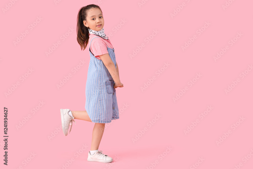 Portrait of fashionable little girl on pink background Portrait of fashionable little girl on pink background