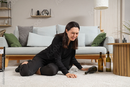 Young woman crying on floor...