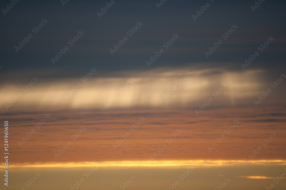 Light shining through clouds in early summer evening