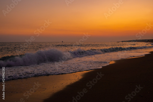 Wallpaper Mural Photo of a wave at an orange sunset on the beach of Turkey Torontodigital.ca