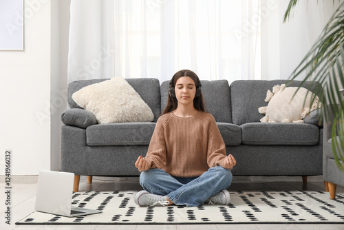 Young woman meditating on f...