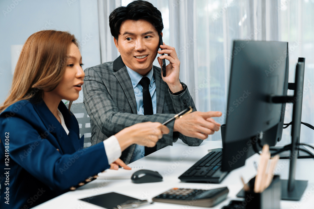Businessman calling with business partner on mobile phone while calculating stock exchange value database with woman coworker on computer, analyzing company value sell or buy on up to date. Infobahn. Businessman calling with business partner on mobile phone while calculating stock exchange value database with woman coworker on computer, analyzing company value sell or buy on up to date. Infobahn.