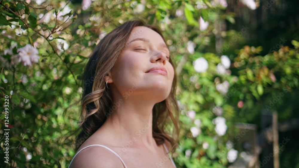 Romantic woman contemplating nature relaxing in park feeling peaceful closeup Romantic woman contemplating nature relaxing in park feeling peaceful closeup