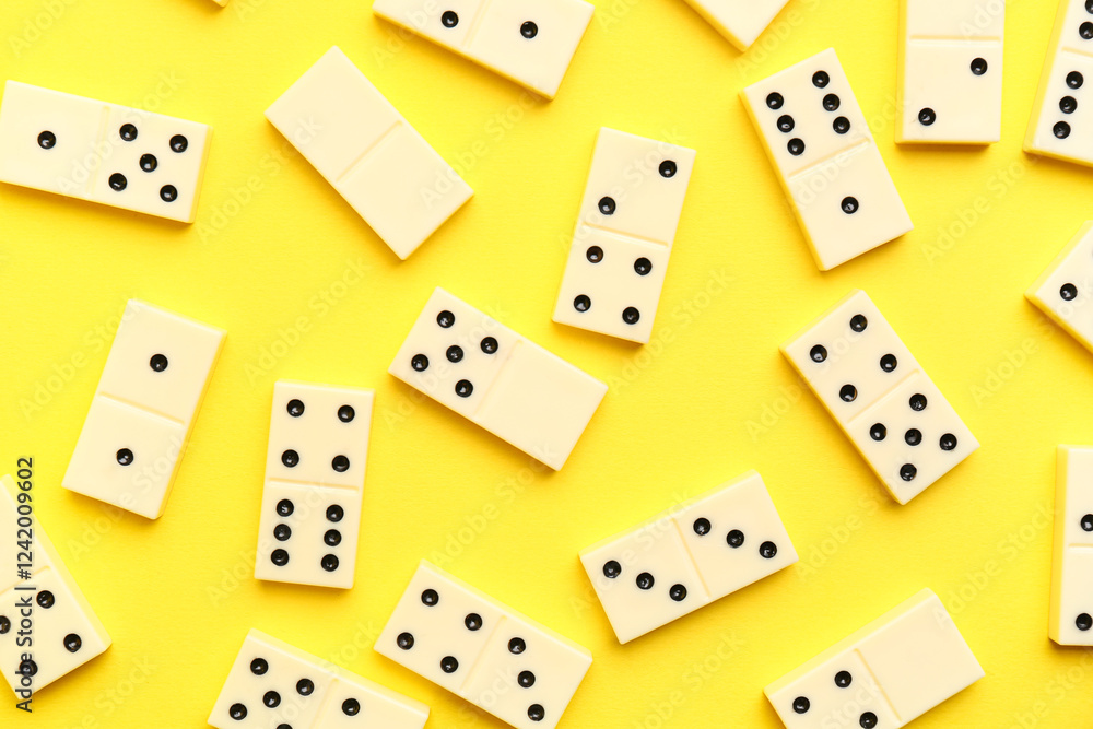 White dominos blocks on yellow background White dominos blocks on yellow background