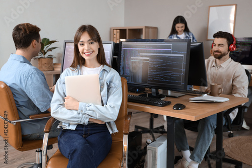 Female programmer with lapt...