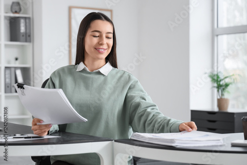 Young businesswoman working...