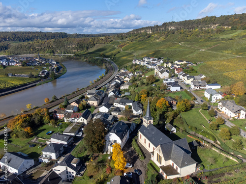 Aerial view of terraced vineyards around Nittel, Rhineland-Palatinate, Germany and views across Moselle River on vineyard hills of Machtum, Luxembourg photo