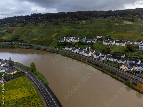 Aerial view of terraced vineyards around Nittel, Rhineland-Palatinate, Germany and views across Moselle River on vineyard hills of Machtum, Luxembourg photo