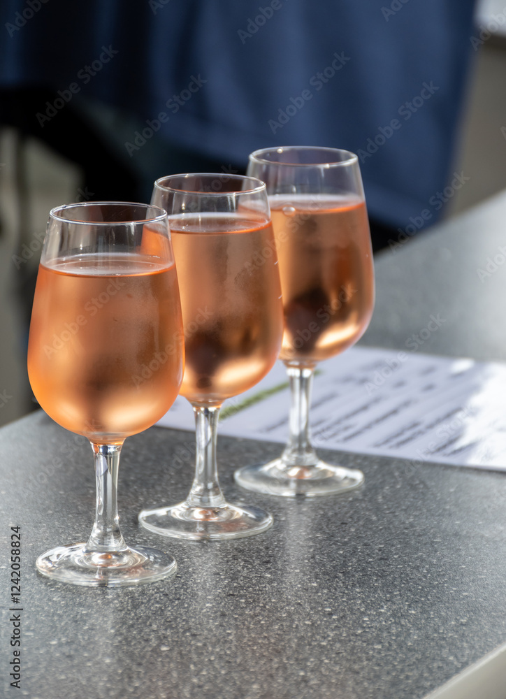 Tasting of white , rose, young dry wine made on Moselle river valley in Germany or Luxembourg, view on terraced vineyards Tasting of white , rose, young dry wine made on Moselle river valley in Germany or Luxembourg, view on terraced vineyards