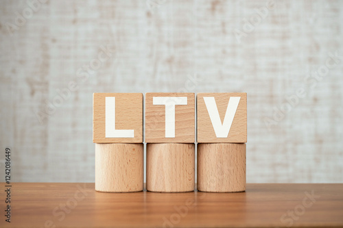 There is wood cube with the word LTV. It is an abbreviation for Life Time Value as eye-catching image. photo