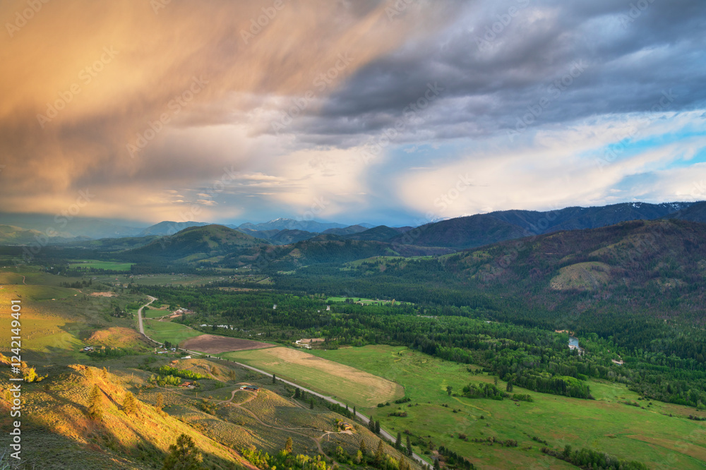 Naklejka premium Storm clouds glowing from setting sun over Methow Valley, North Cascades, Washington State