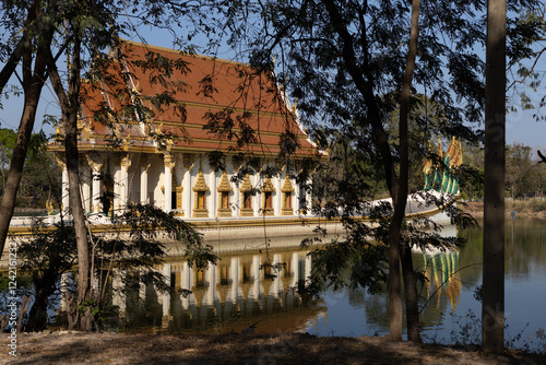 Background of beautiful religious tourist attraction,the church in the middle of the river in Wat Sa Prasan Suk (Wat Ban Na Muang), Ubon Ratchathani,Thailand,has ancient sculptures worth studying. photo