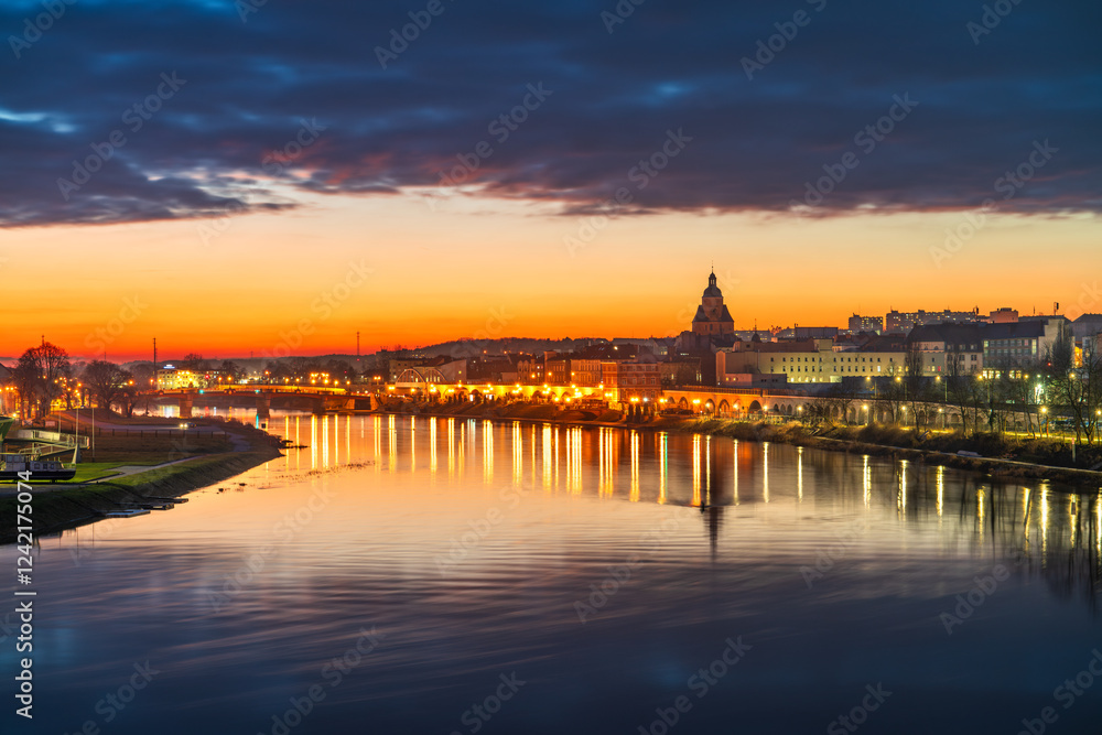 Fototapeta premium Gorzow Wielkopolski city skyline overlooking St. Mary's church tower at sunset. Poland