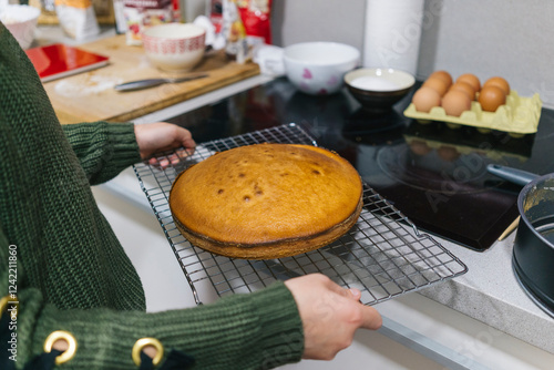 Freshly baked cake on cooling rack photo