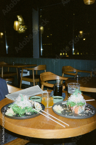 Delicious table of Japanese food: sushi, salmon, shoyu and chopsticks photo