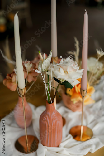 Elegant Floral Vase Arrangement with Candles photo