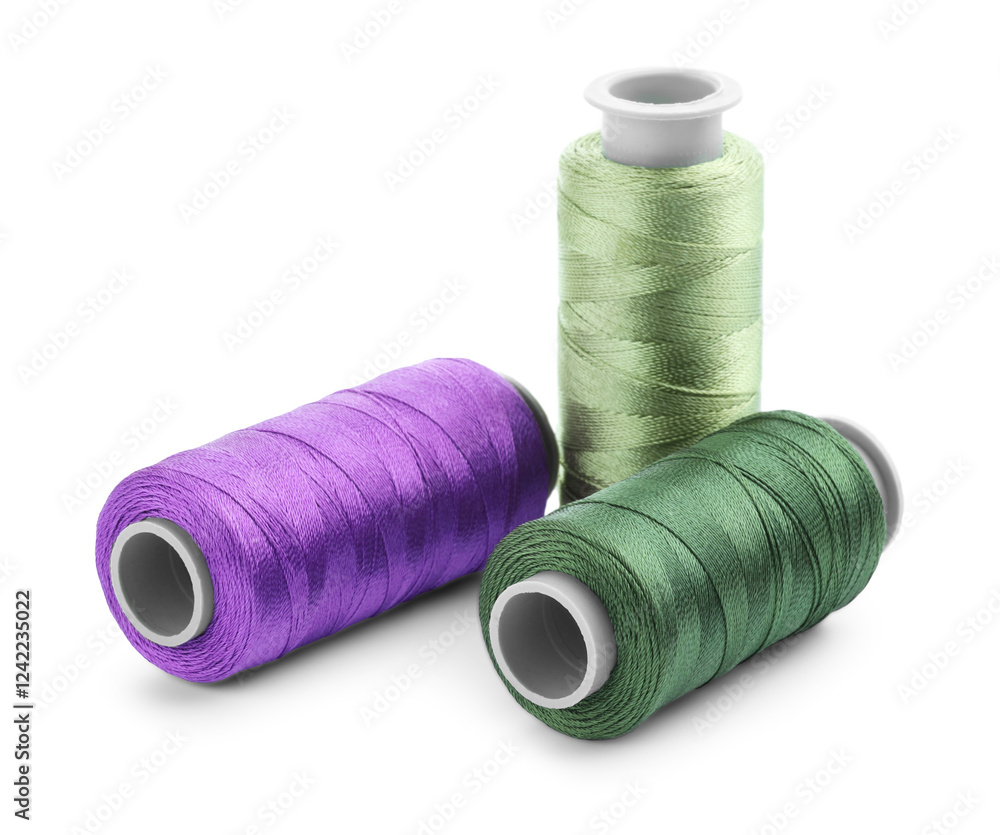 Spools of bright sewing threads isolated on white Spools of bright sewing threads isolated on white