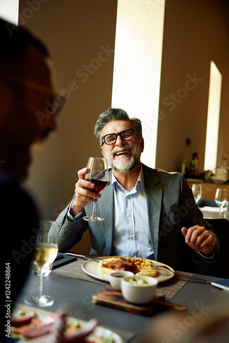 Businessmen enjoys lunch at the restaurant photo