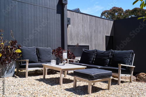 Outdoor seating area with modern design and natural elements photo