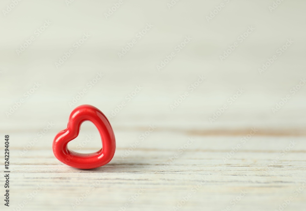 Red decorative heart on white wooden table, space for text. Happy Valentine's day Red decorative heart on white wooden table, space for text. Happy Valentine's day