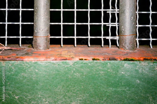 Rusty Metal Fence with Wire Mesh Close-Up photo