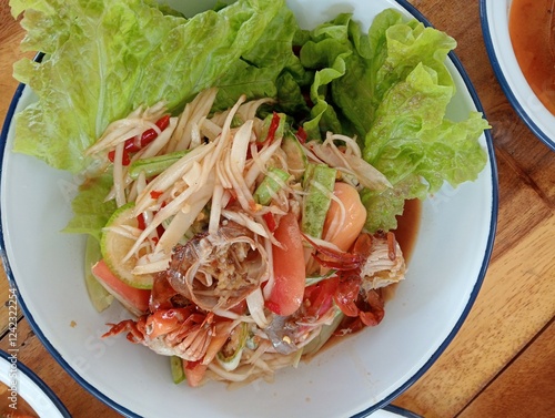 Somtam Thai, delicious, spicy on a beautiful plate.
