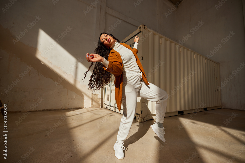Happy black woman dancing on street